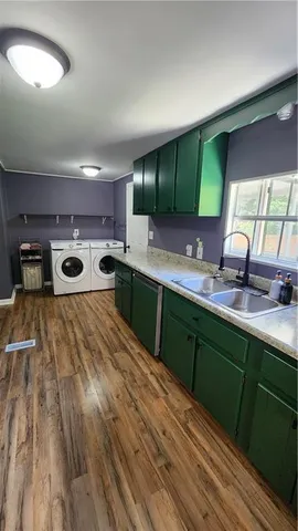 a spacious bathroom with a double vanity sink and a large mirror