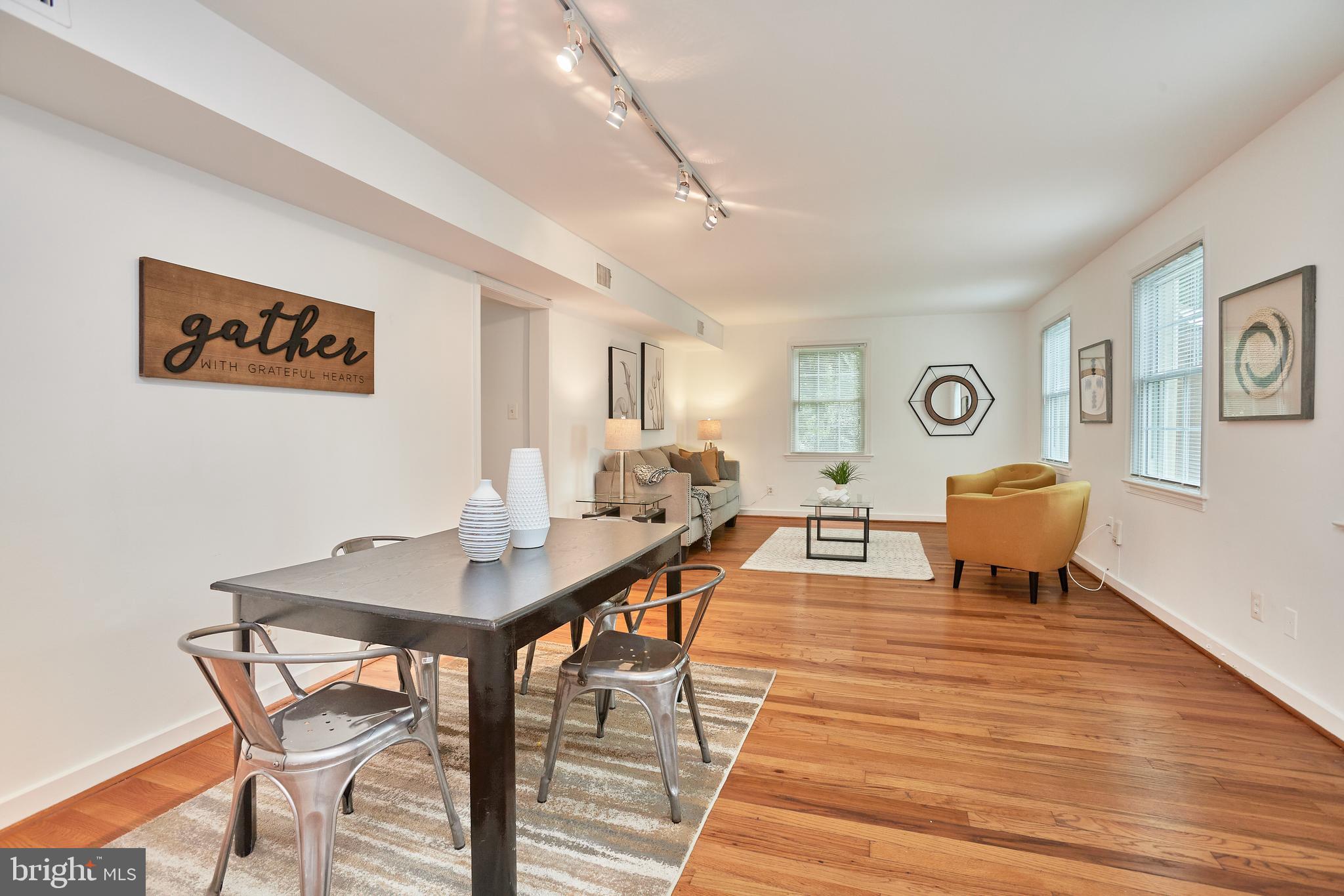 2248 Washington Avenue, Unit W102 Silver Spring, MD 20910 - Photo 7 of 28 Open dining and living room area.