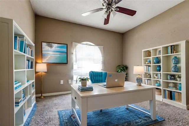 a view of a workspace with furniture