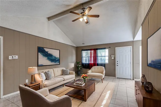 a living room with furniture and a large window