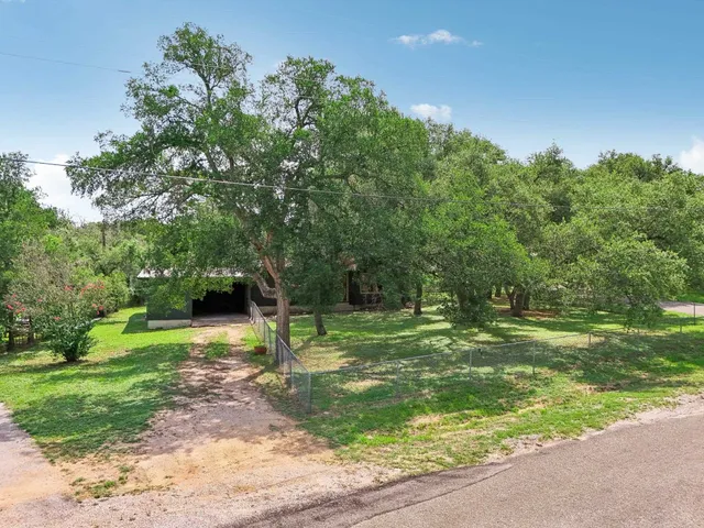 a view of field with trees in the background