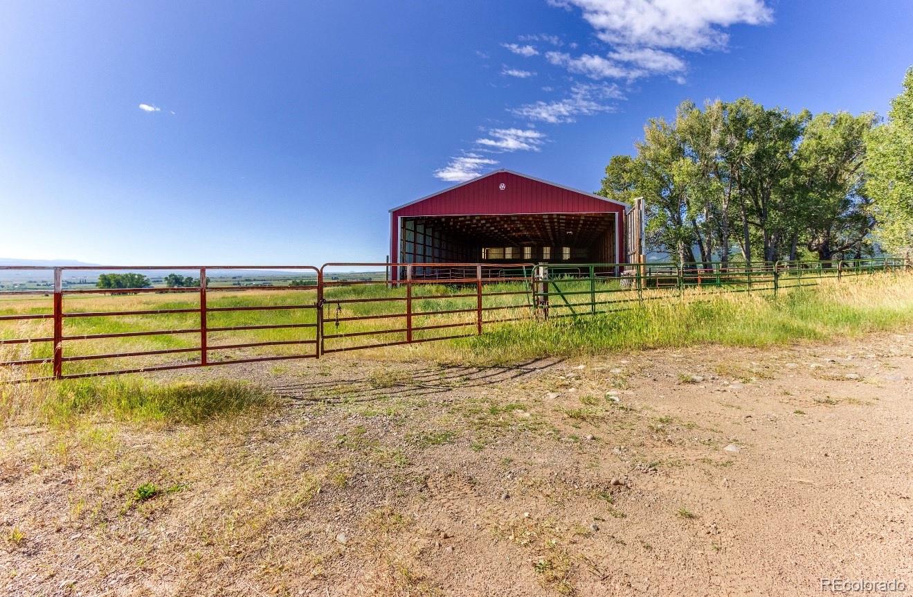 1290 Hill Country Road Westcliffe, CO 81252 - Photo 17 of 24 a view of a house with a yard