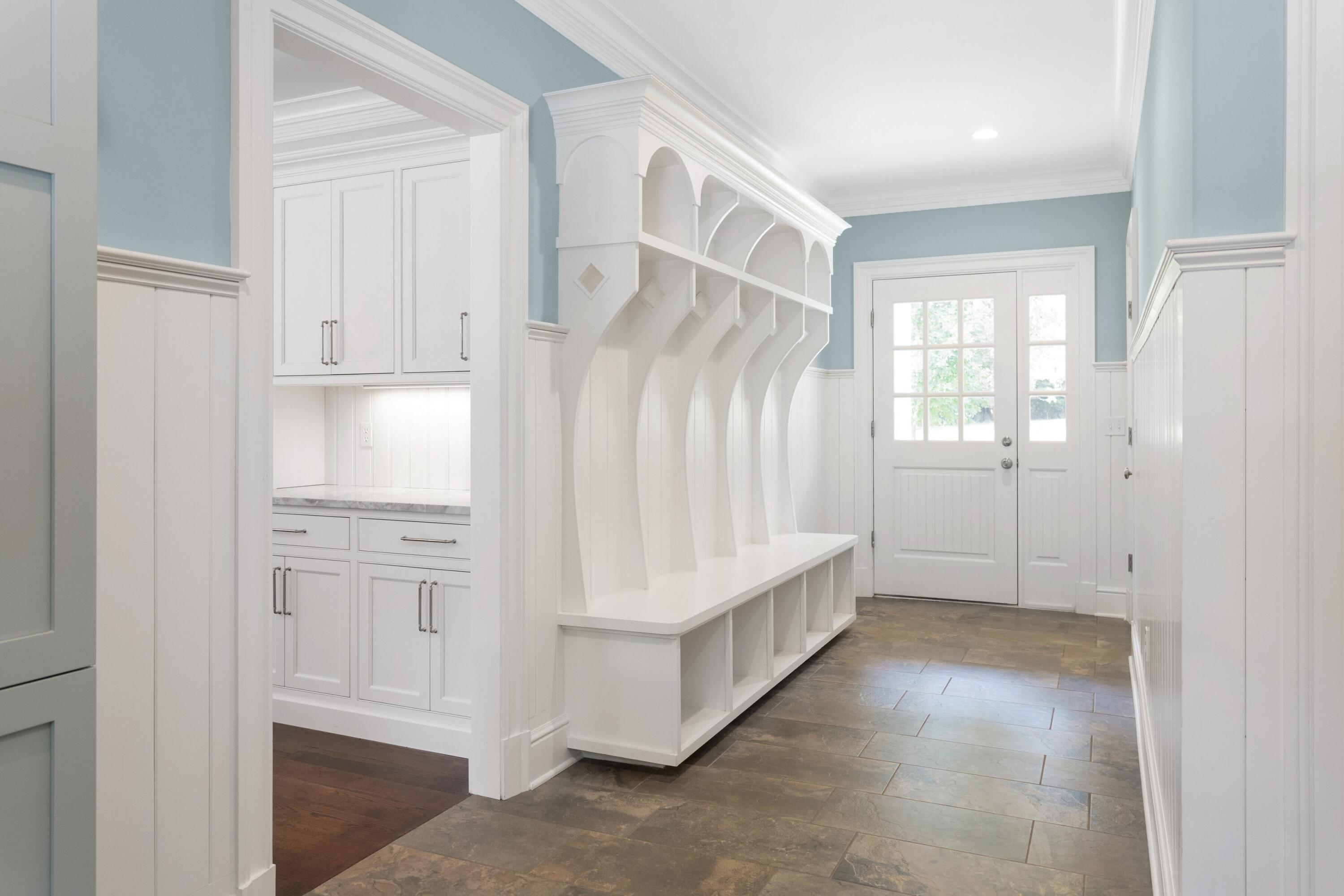46 Stanton Road Darien, CT 06820 - Photo 21 of 48 an entryway with wooden floor and cabinet