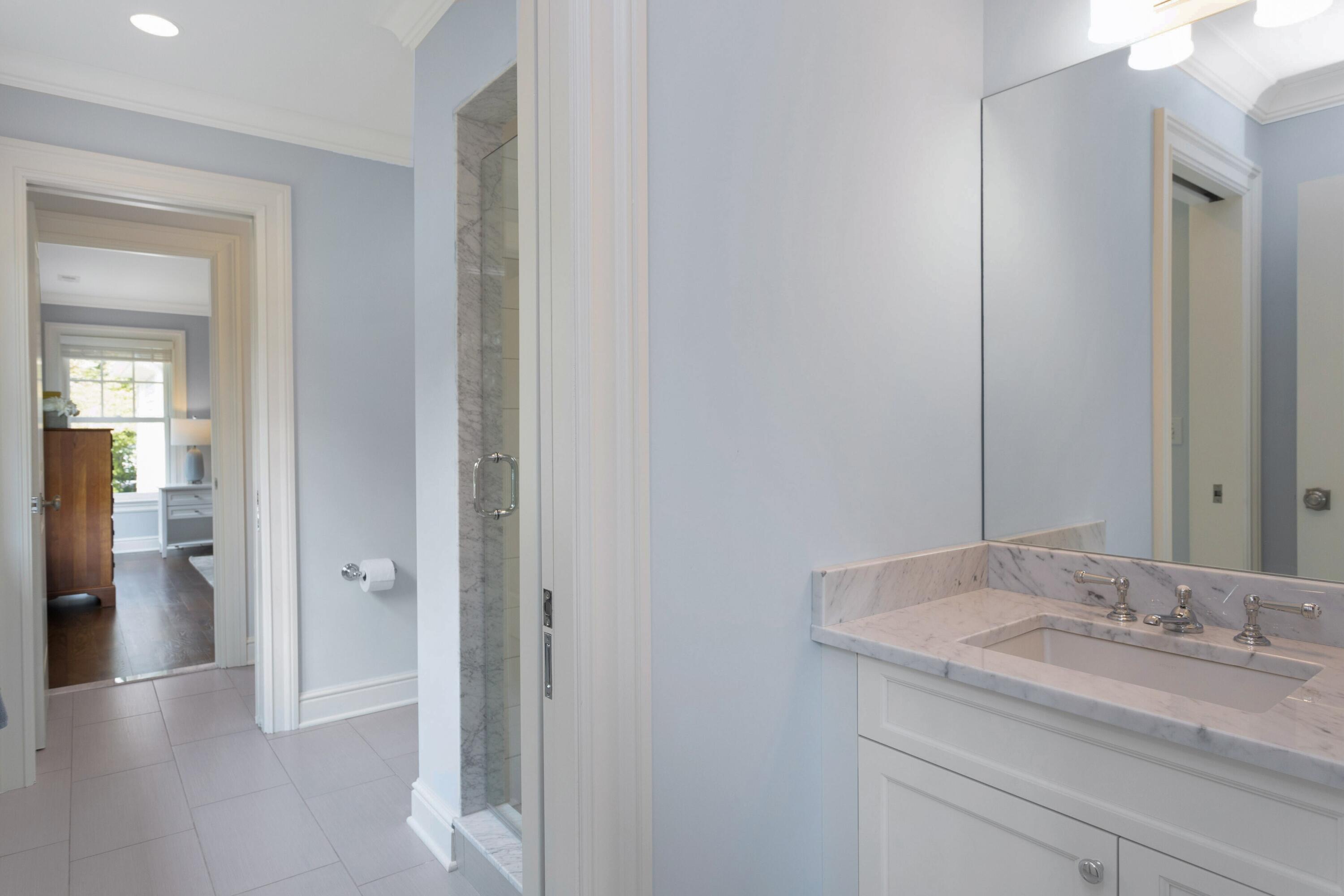46 Stanton Road Darien, CT 06820 - Photo 27 of 48 a bathroom with a granite countertop sink and a mirror