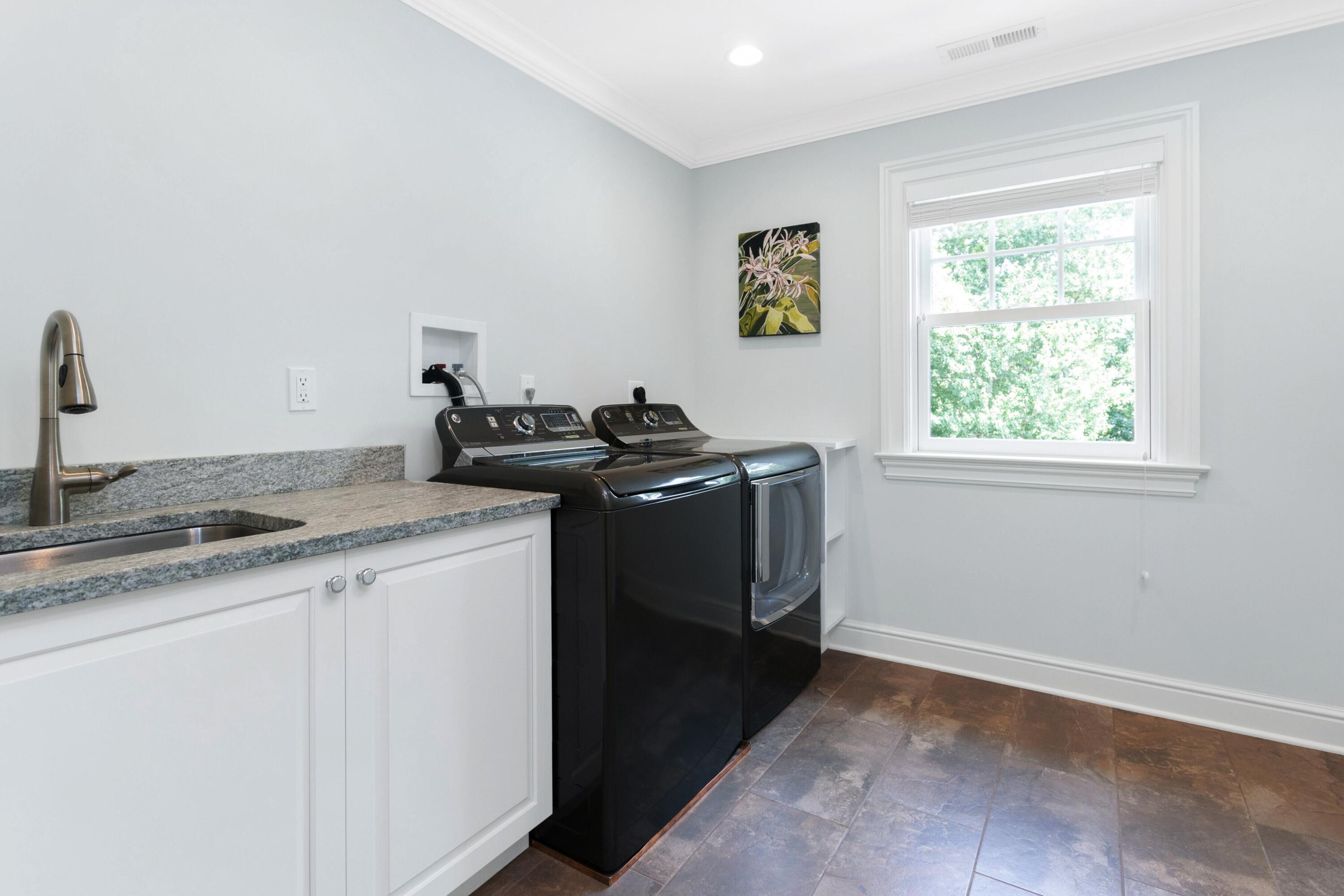 46 Stanton Road Darien, CT 06820 - Photo 35 of 48 a utility room with faucet washer and dryer