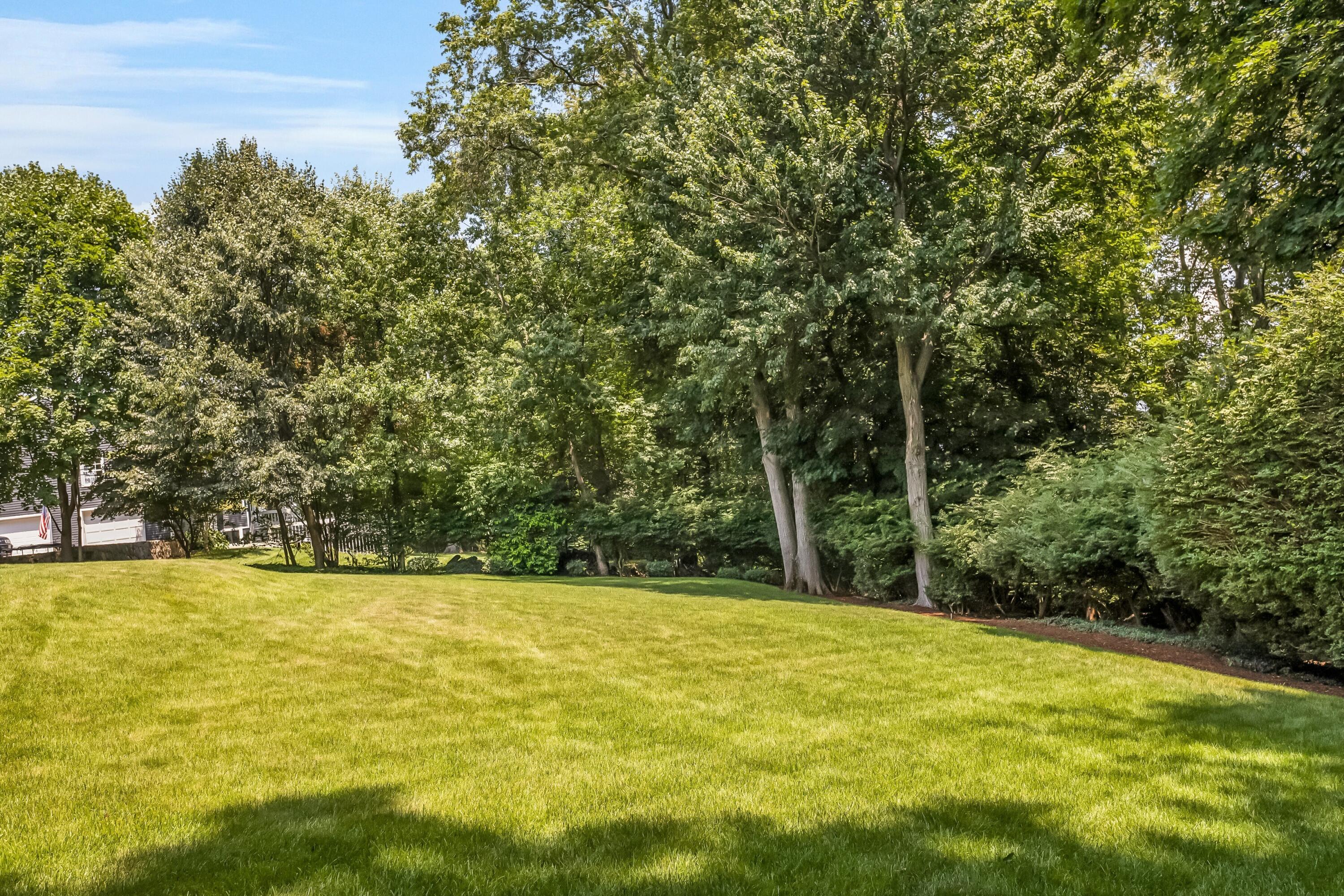 46 Stanton Road Darien, CT 06820 - Photo 42 of 48 a view of a swimming pool with an outdoor space and seating area