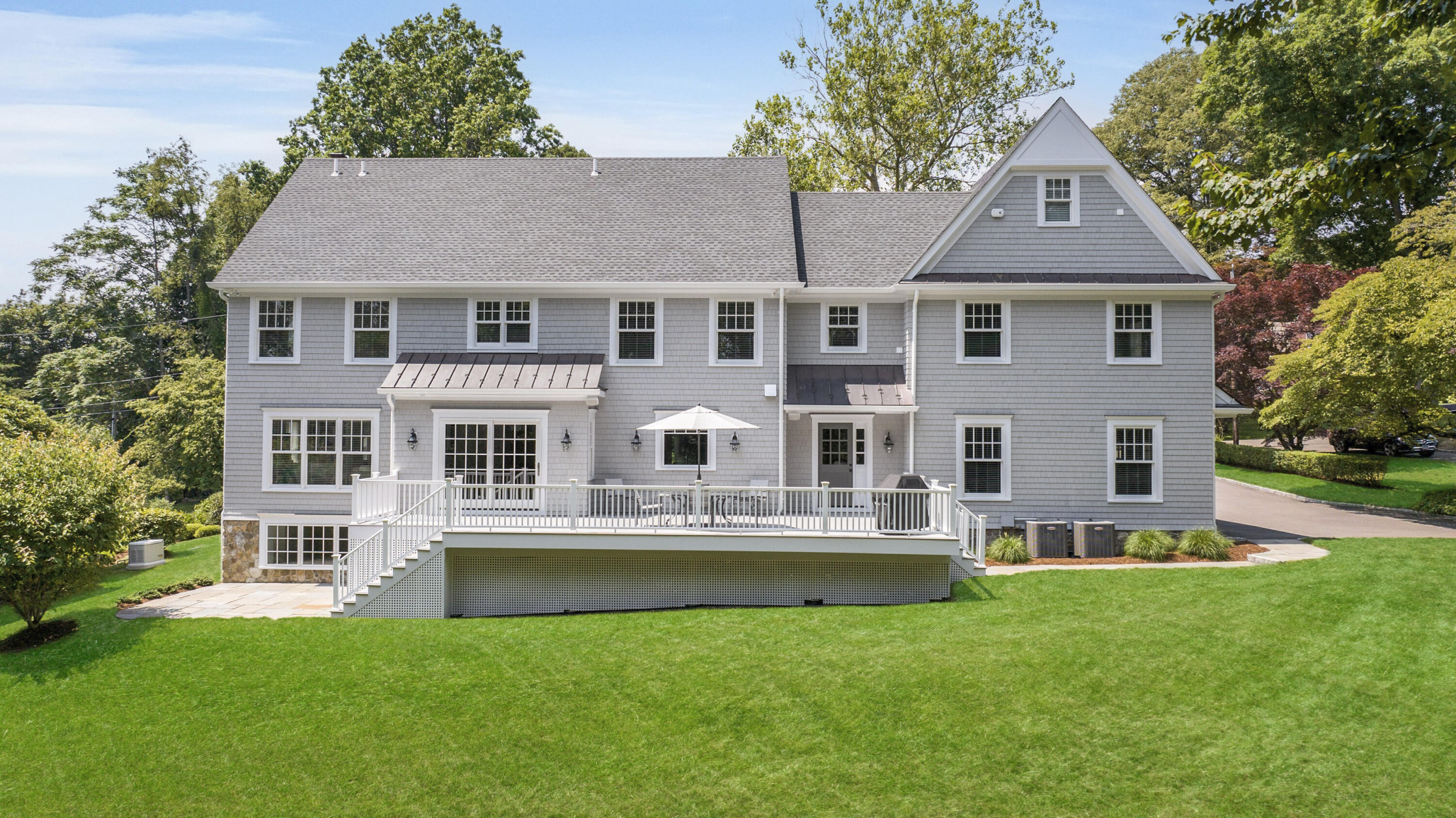 46 Stanton Road Darien, CT 06820 - Photo 44 of 48 a front view of a house with a yard