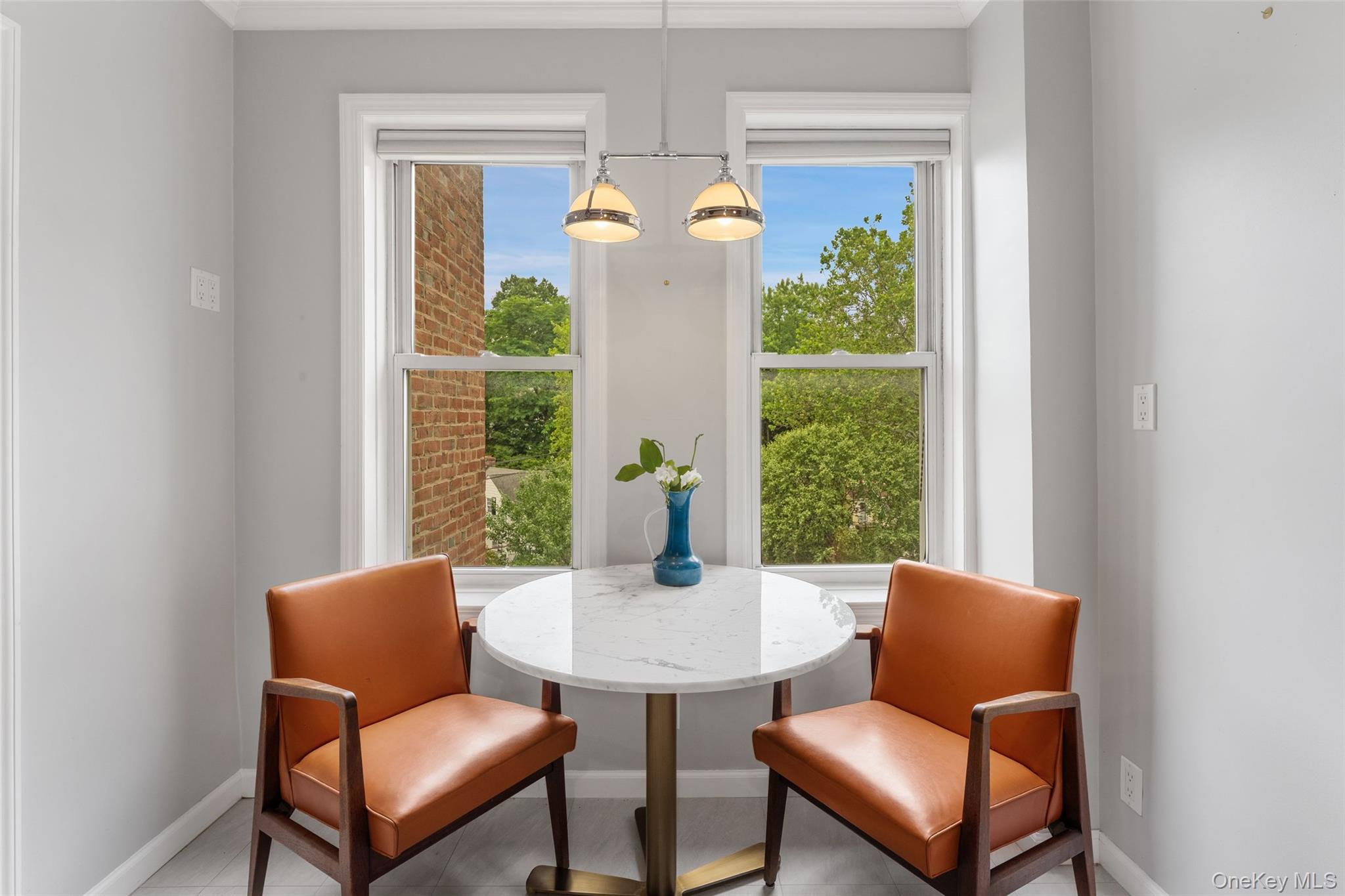 280 Bronxville Road, Unit 8B Bronxville, NY 10708 - Photo 4 of 14 Dine-in Kitchen with 2 windows and tree-to[ views.