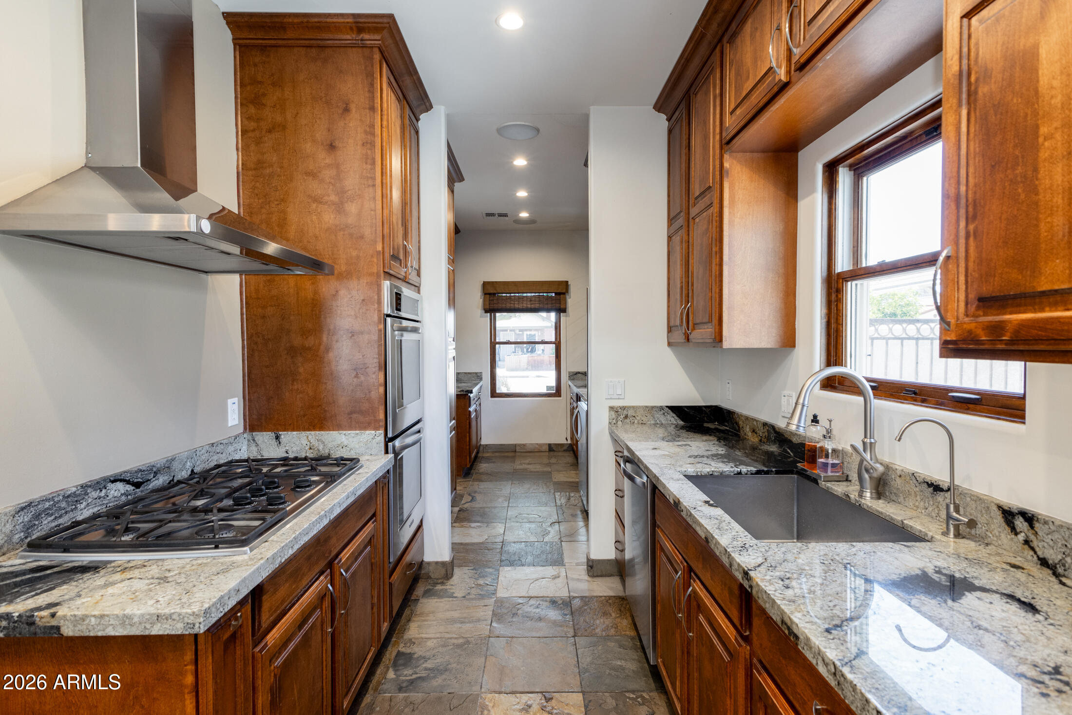 2517 North 8th Street Phoenix, AZ 85006 - Photo 12 of 48 a kitchen with a stove a sink and a refrigerator
