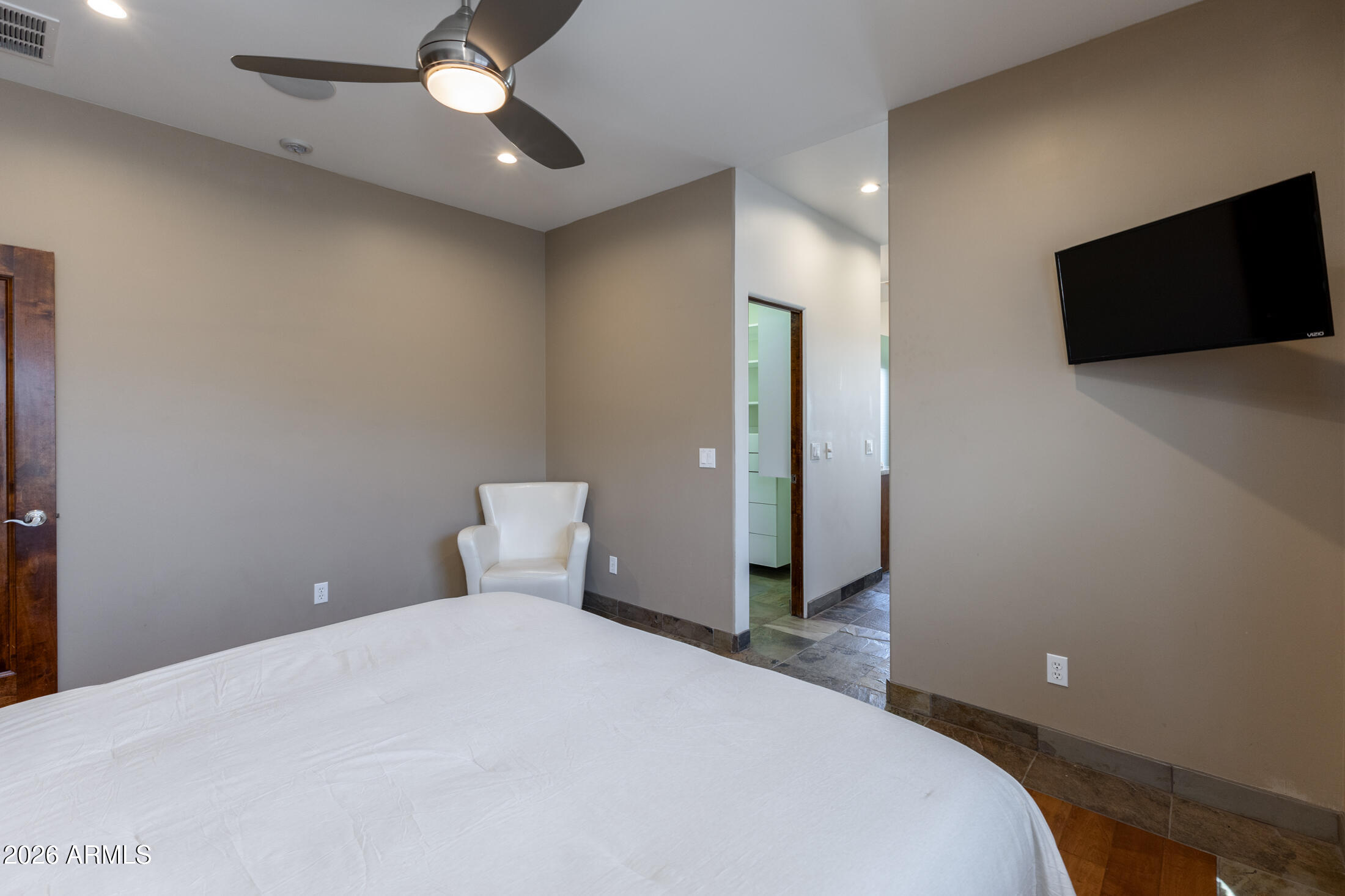 2517 North 8th Street Phoenix, AZ 85006 - Photo 16 of 48 a bedroom with a bed and a flat screen tv