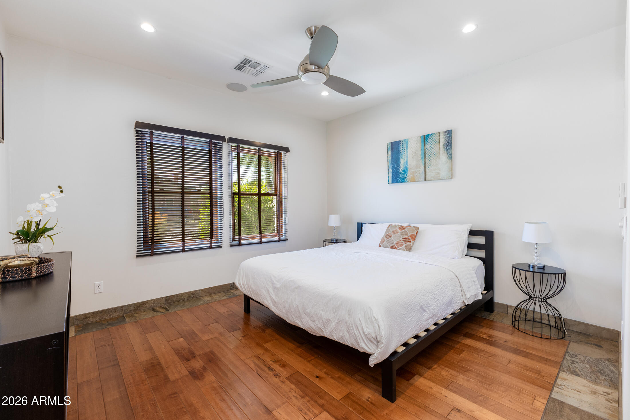 2517 North 8th Street Phoenix, AZ 85006 - Photo 23 of 48 a bedroom with a large bed chandelier and a window