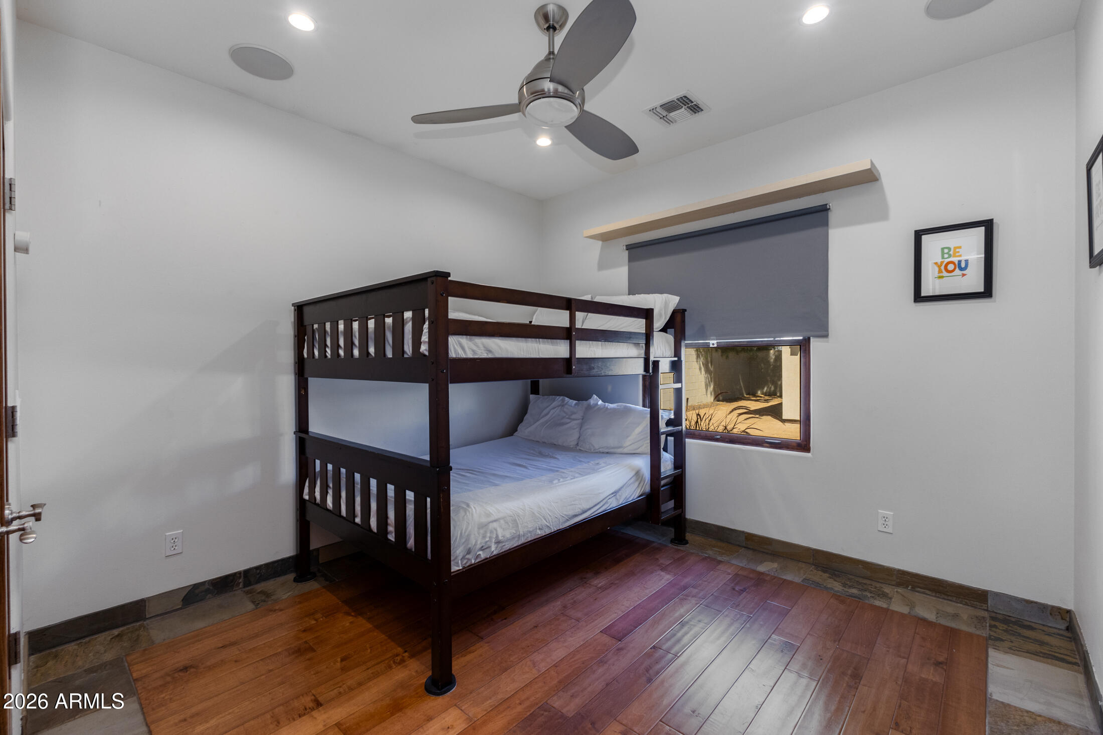 2517 North 8th Street Phoenix, AZ 85006 - Photo 28 of 48 a bedroom with a bed and wooden floor