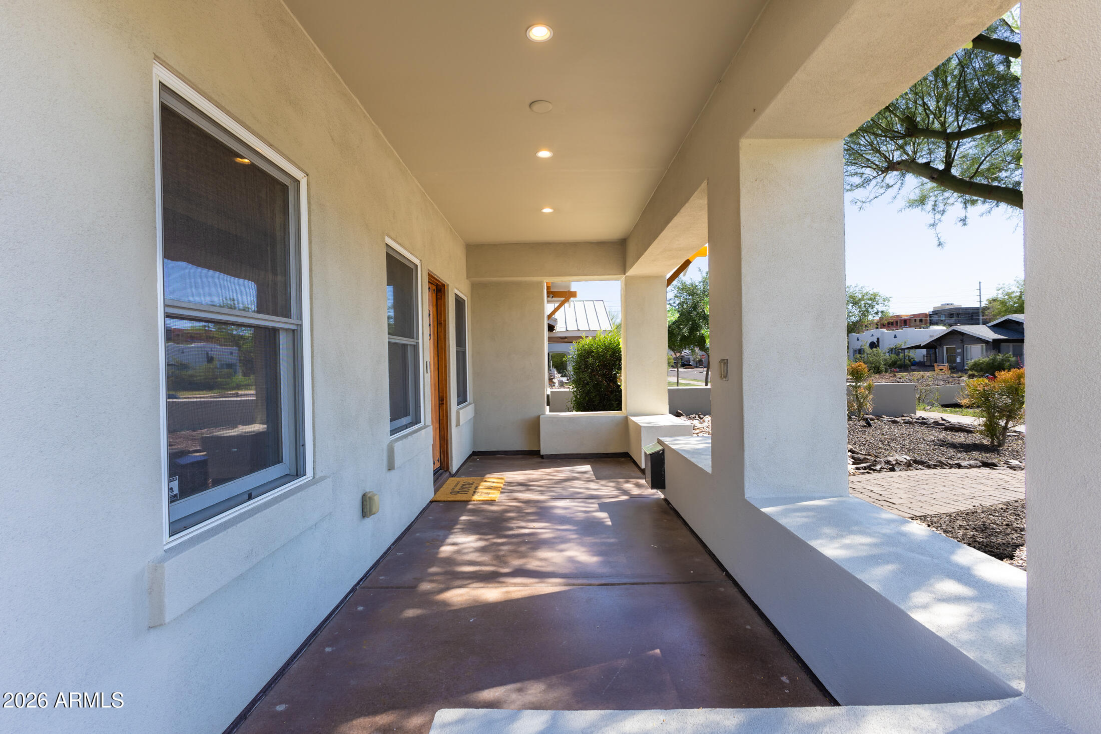 2517 North 8th Street Phoenix, AZ 85006 - Photo 4 of 48 a view of a hallway with a couch and a potted plant