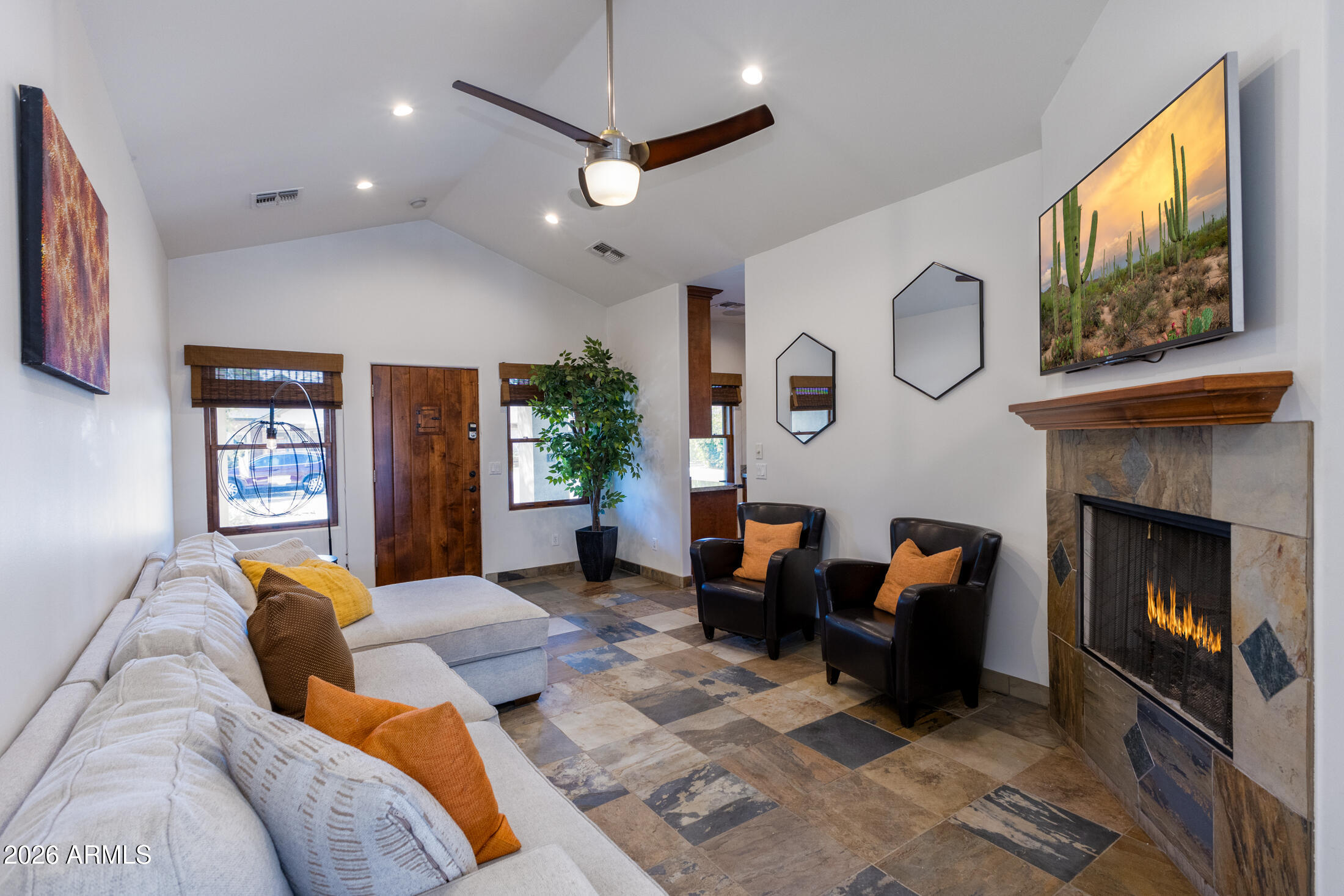 2517 North 8th Street Phoenix, AZ 85006 - Photo 6 of 48 a living room with furniture a fireplace and a flat screen tv