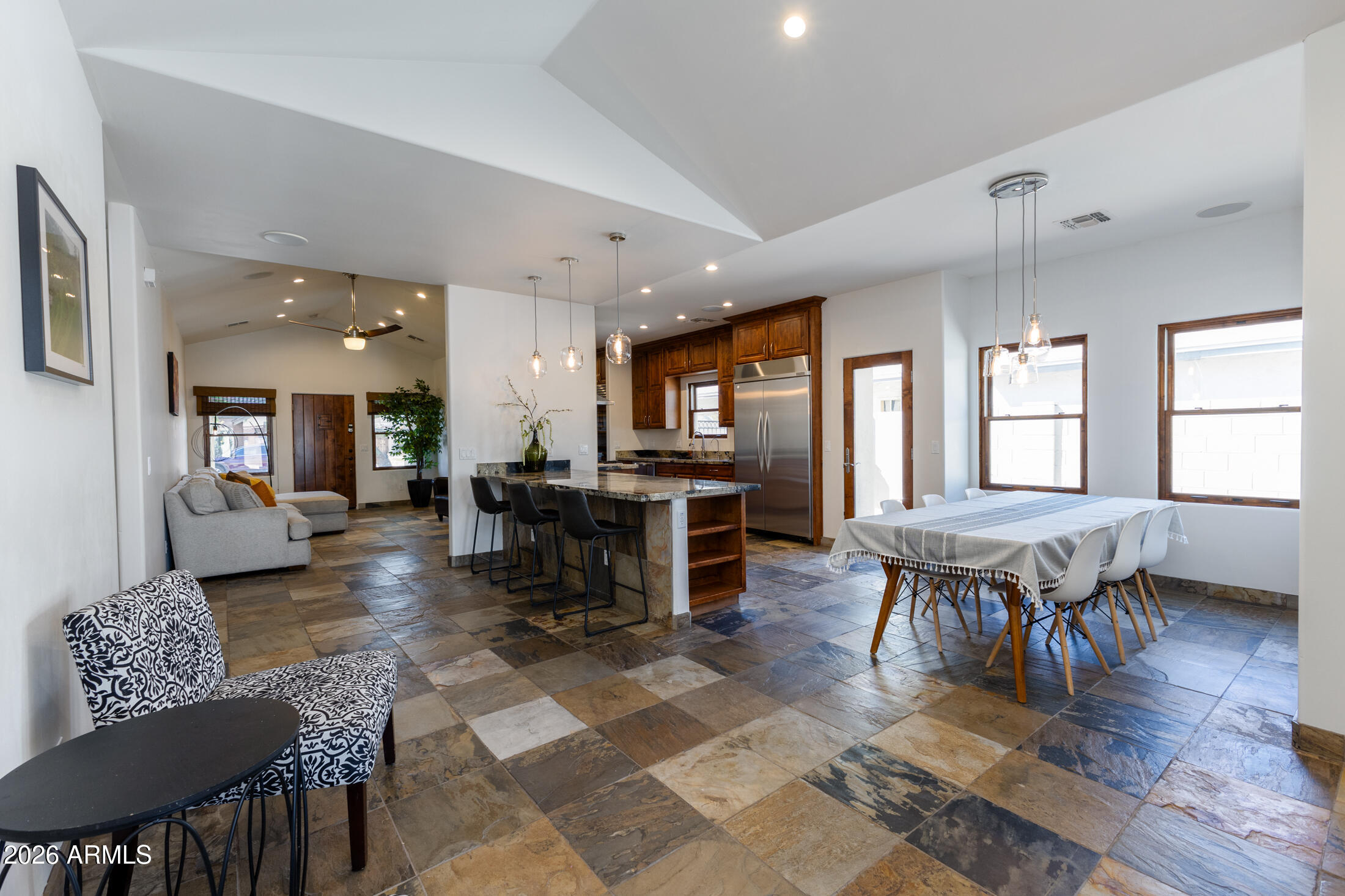 2517 North 8th Street Phoenix, AZ 85006 - Photo 7 of 48 a living room with furniture a dining table and a refrigerator