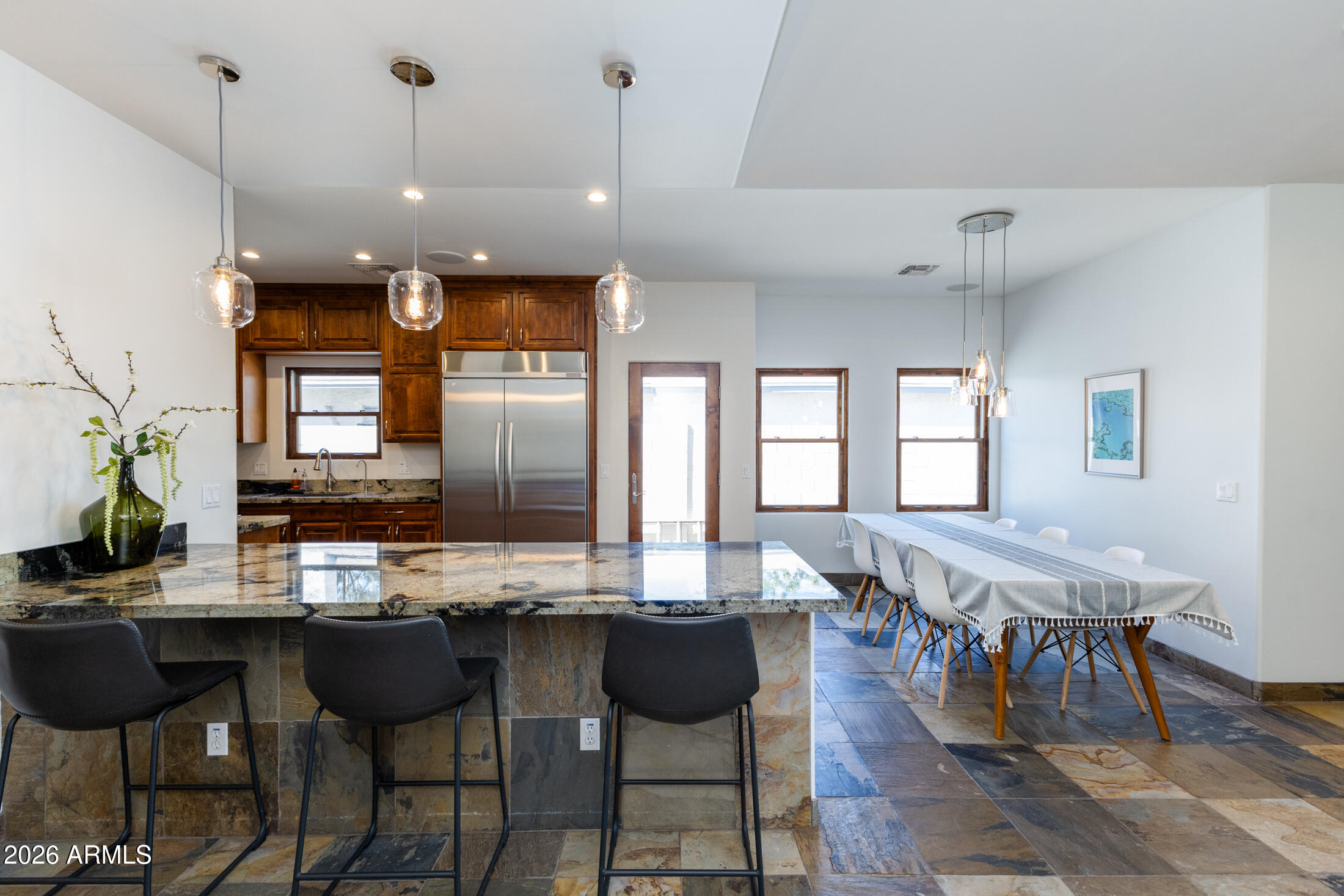 2517 North 8th Street Phoenix, AZ 85006 - Photo 9 of 48 a dining table with chairs and kitchen view