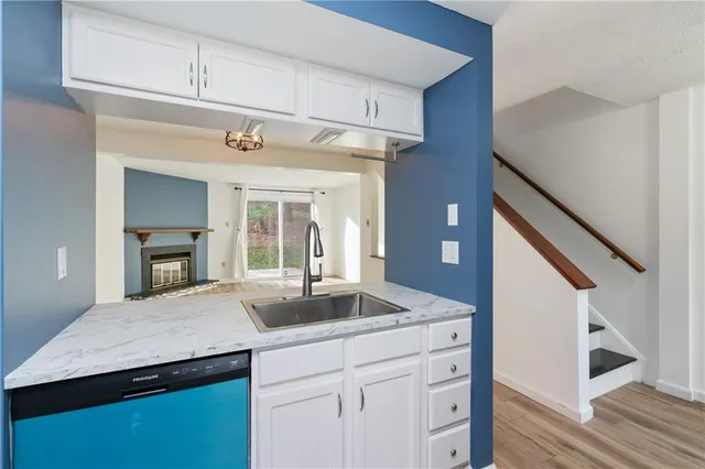 a kitchen with a sink and a refrigerator
