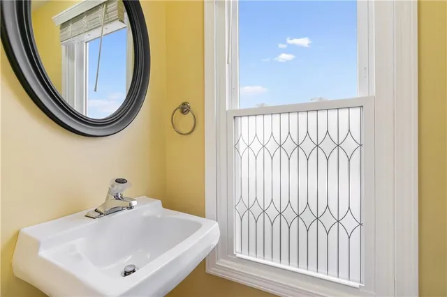 a bathroom with a sink and a mirror