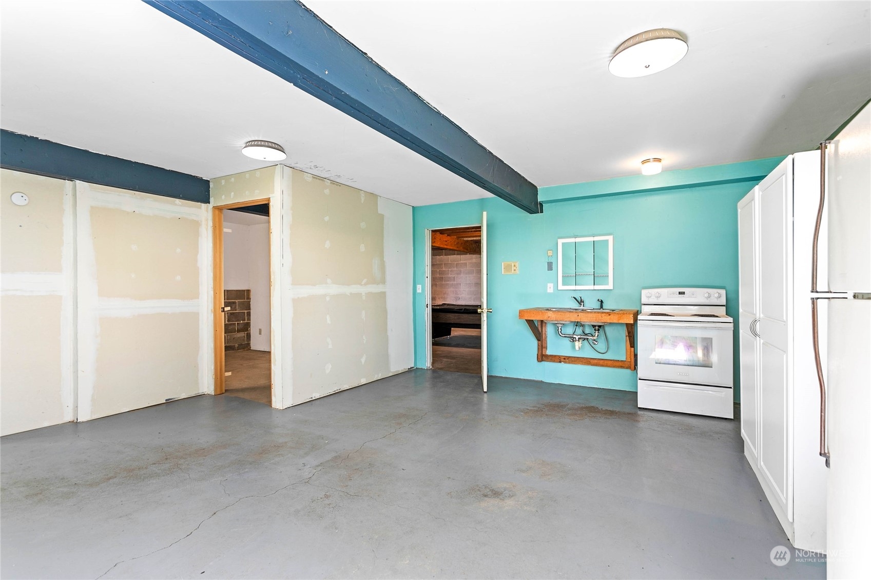 6402 Goodwin Road Everson, WA 98247 - Photo 24 of 39 a view of an empty room with a kitchen