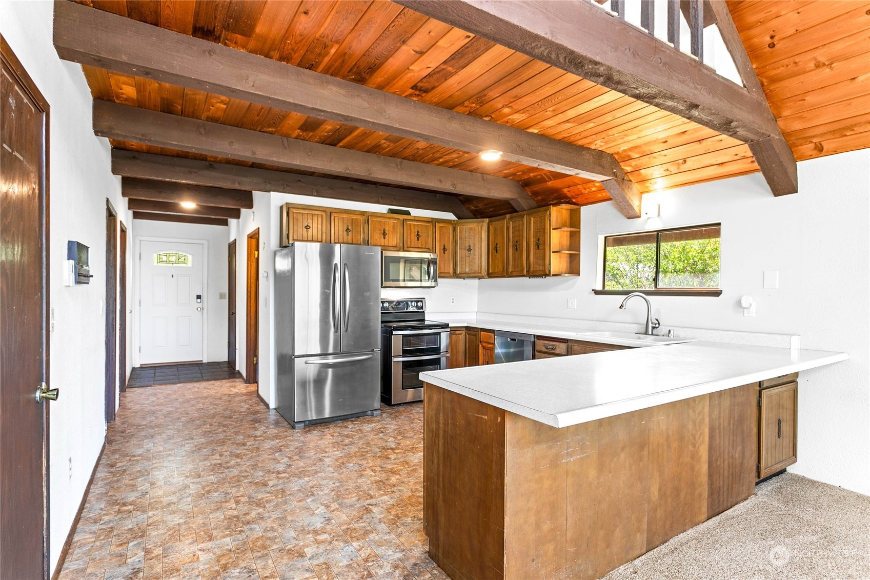 6402 Goodwin Road Everson, WA 98247 - Photo 3 of 39 a kitchen with stainless steel appliances granite countertop a sink and a refrigerator