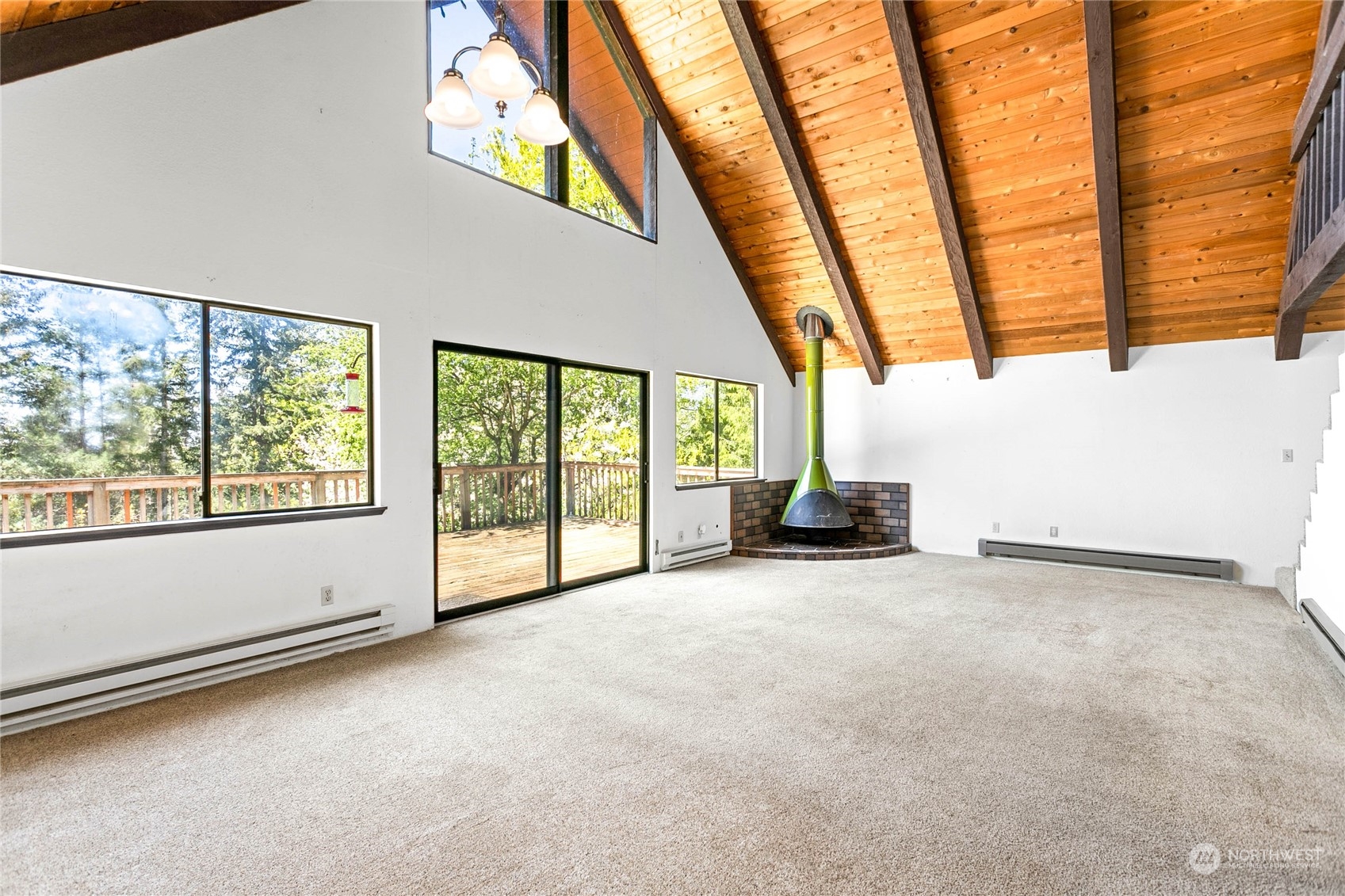 6402 Goodwin Road Everson, WA 98247 - Photo 10 of 39 a view of an empty room with a fireplace and windows