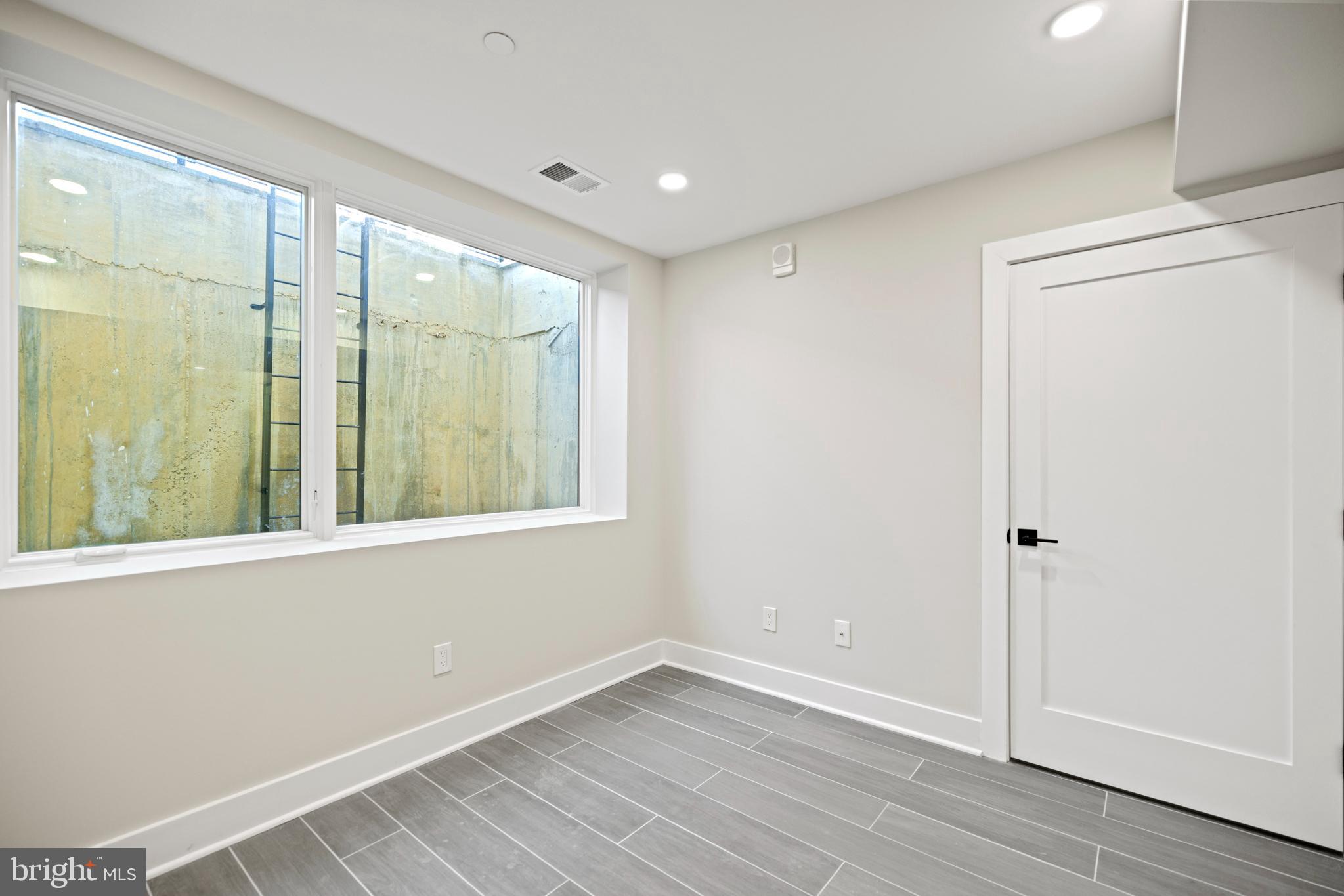824 18th Street Northeast, Unit 2 Washington, DC 20002 - Photo 12 of 15 an empty room with wooden floor and windows