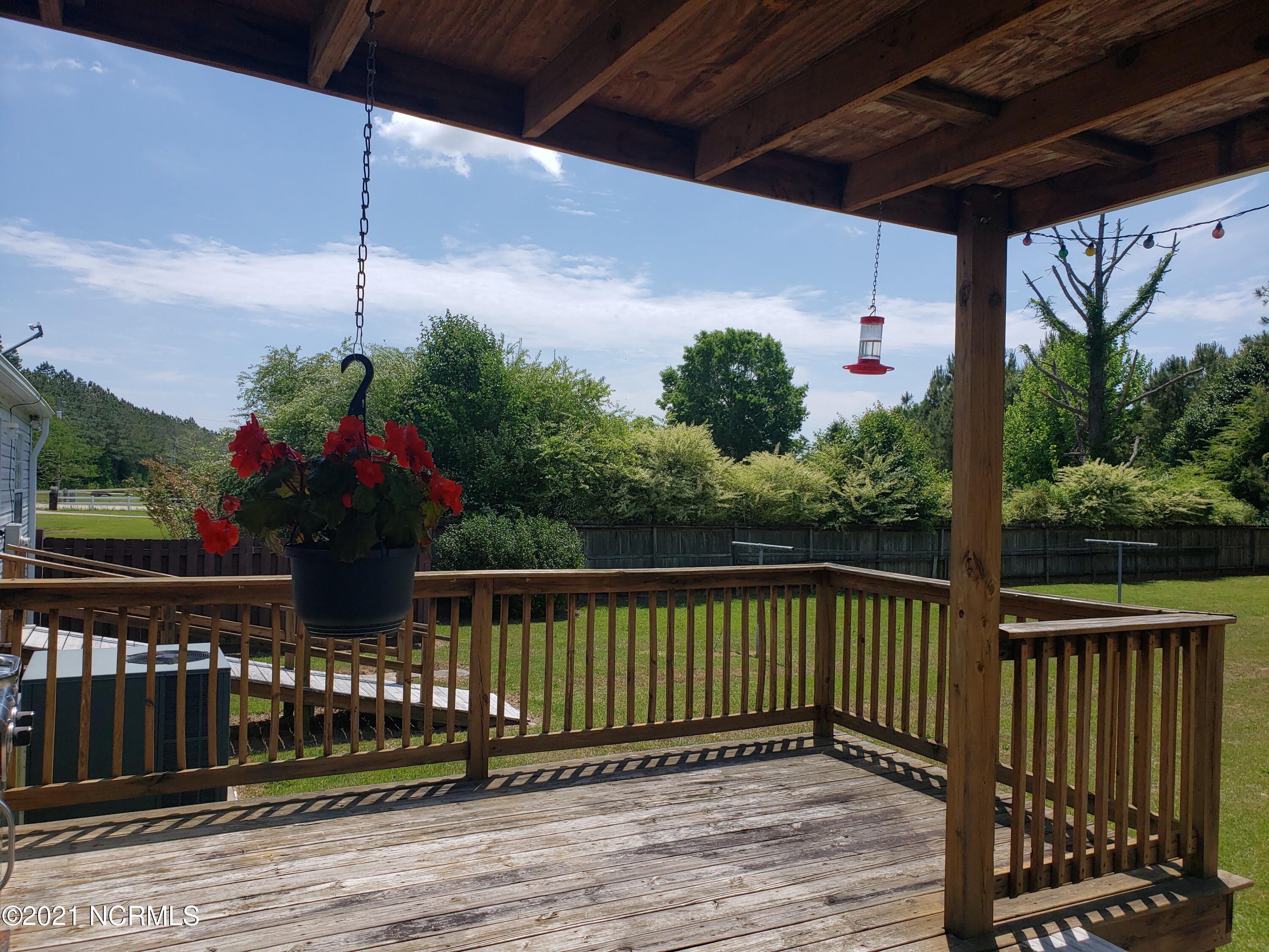 2459 Stout Road Northwest Ash, NC 28420 - Photo 14 of 19 Large deck off back of home.