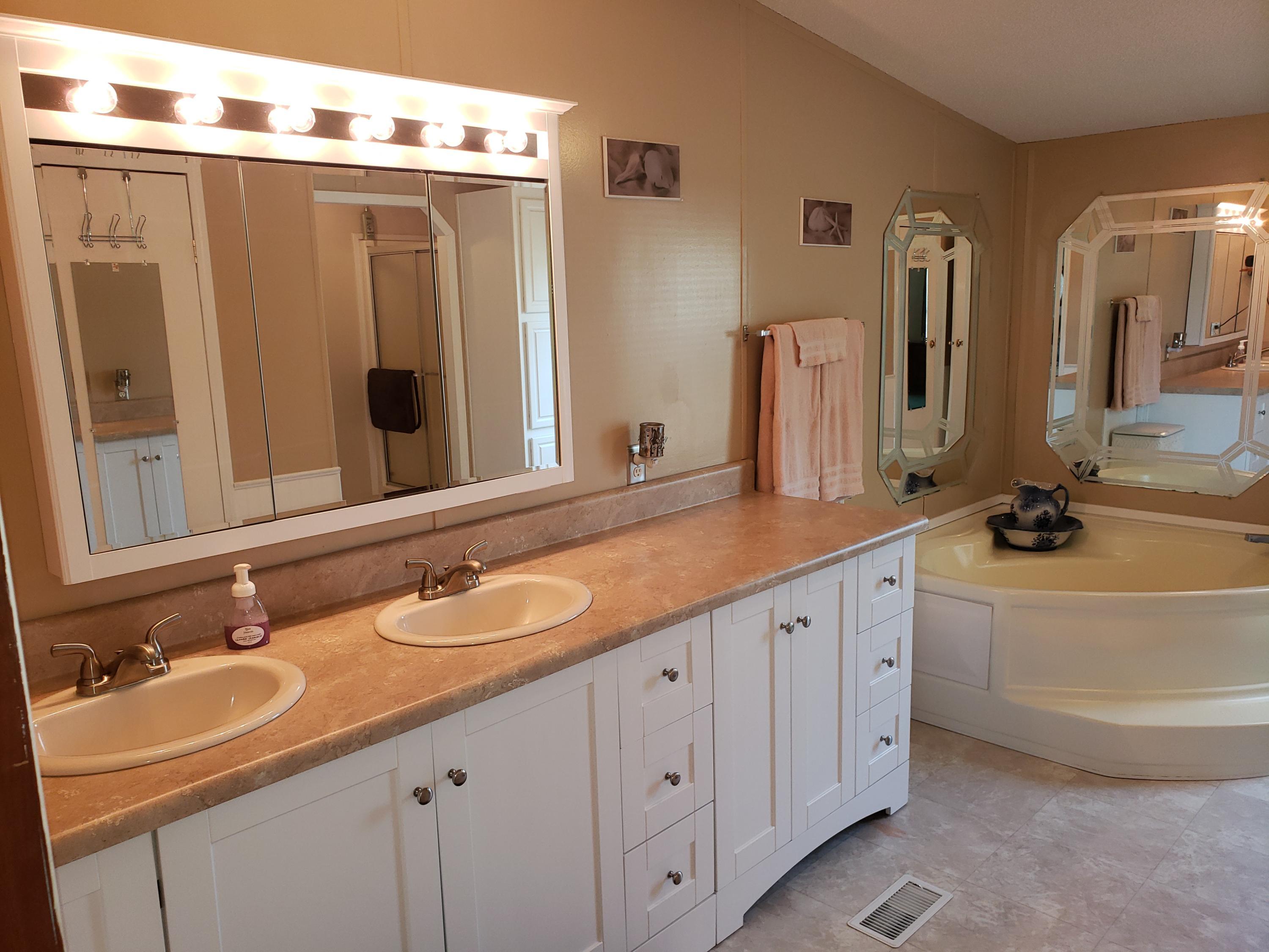 2459 Stout Road Northwest Ash, NC 28420 - Photo 7 of 19 New vanity, vanity top, hardware, lighting and cabinet w/mirror.