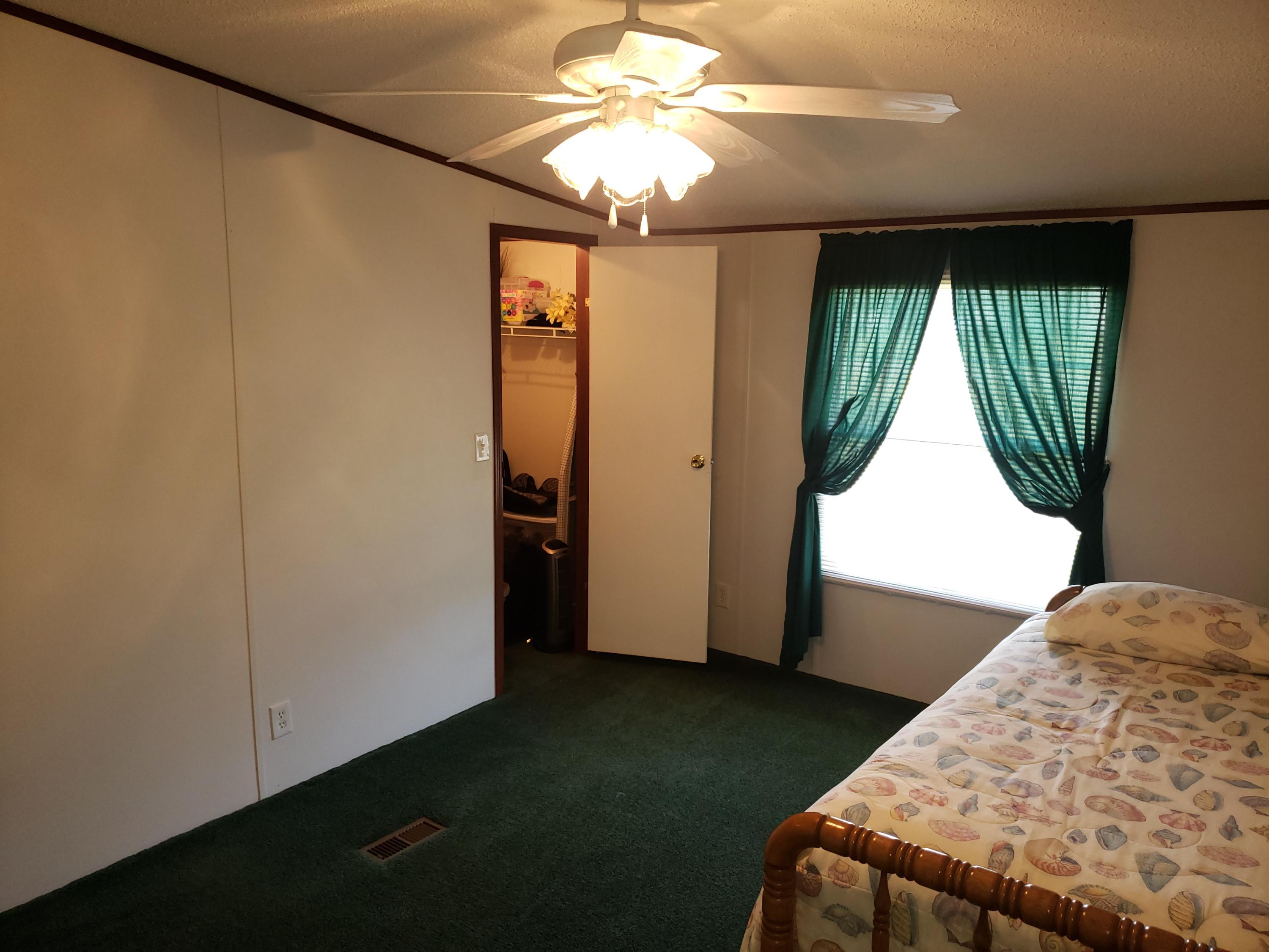 2459 Stout Road Northwest Ash, NC 28420 - Photo 10 of 19 Spacious bedroom with walk-in closet.