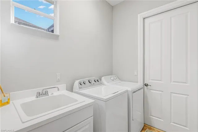 a utility room with dryer and washer