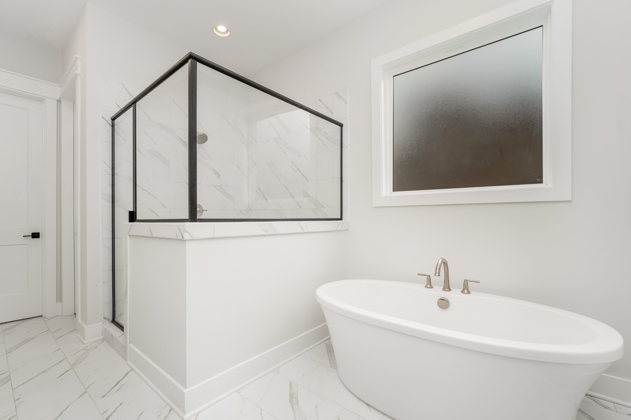 349 Bournemouth Lane Hermitage, TN 37076 - Photo 30 of 60 a white bath tub sitting next to a white sink and vanity