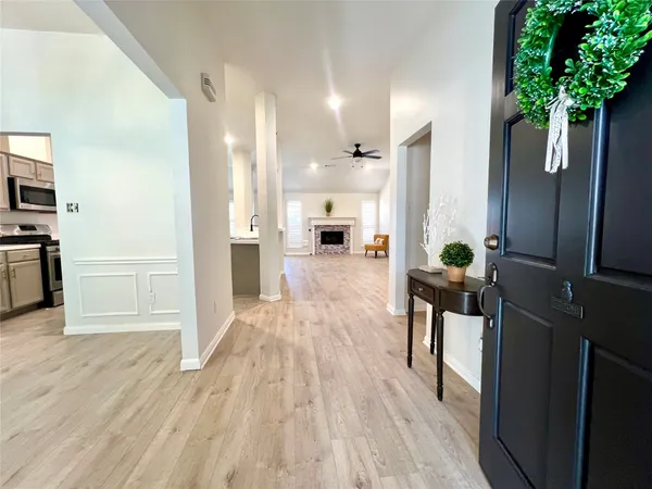 a view of a living hall with wooden floor