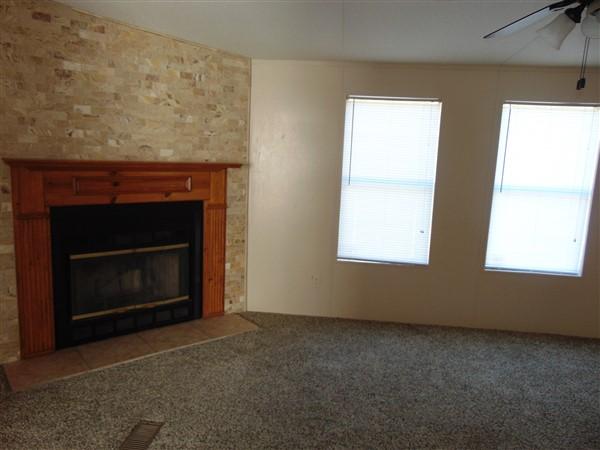 1051 Hinote Road DeFuniak Springs, FL 32433 - Photo 16 of 39 a living room with a fireplace in it