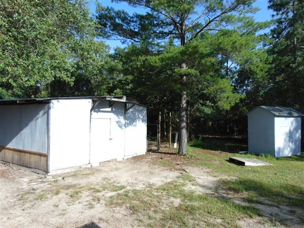 1051 Hinote Road DeFuniak Springs, FL 32433 - Photo 17 of 39 a backyard of a house with lots of green space