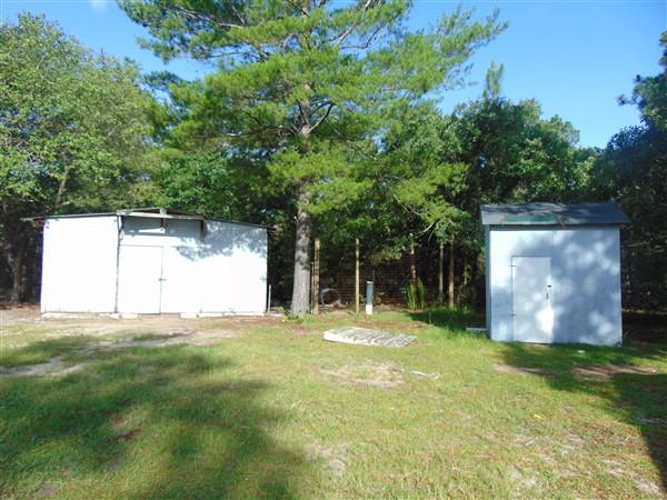 1051 Hinote Road DeFuniak Springs, FL 32433 - Photo 2 of 39 a backyard of a house with table and chairs
