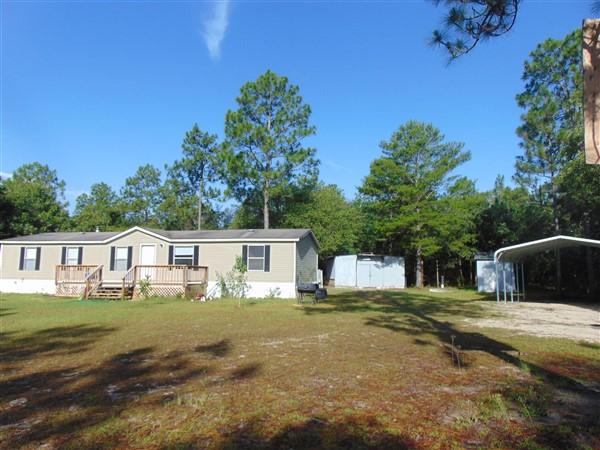 1051 Hinote Road DeFuniak Springs, FL 32433 - Photo 24 of 39 a house view with a garden space
