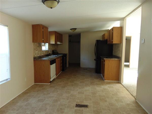 1051 Hinote Road DeFuniak Springs, FL 32433 - Photo 28 of 39 a kitchen with stainless steel appliances granite countertop a refrigerator a stove and a sink