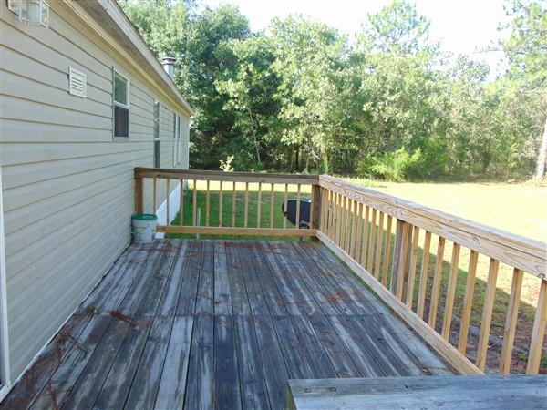 1051 Hinote Road DeFuniak Springs, FL 32433 - Photo 7 of 39 a view of balcony with wooden floor