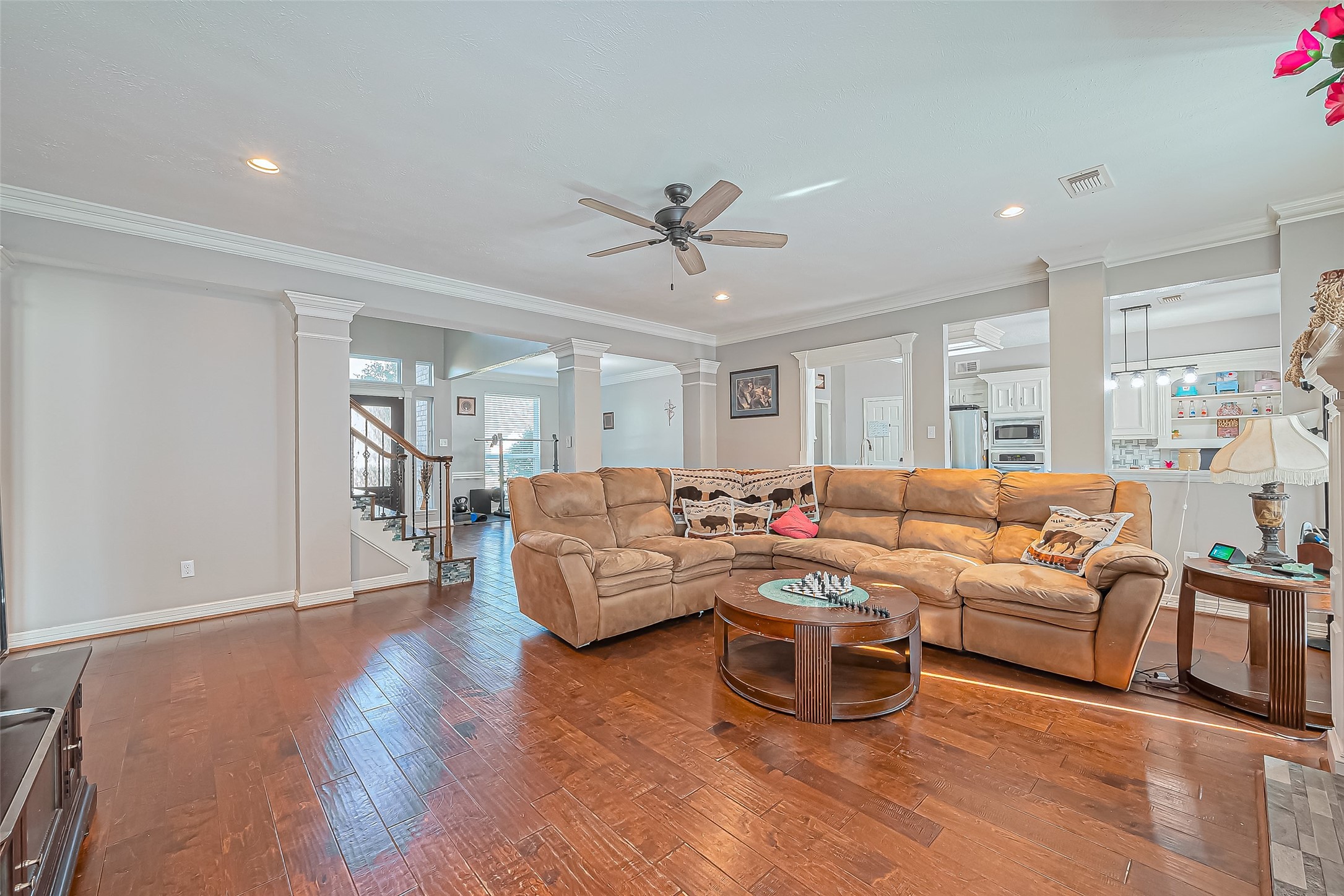5803 Slashwood Lane Spring, TX 77379 - Photo 14 of 46 Expansive living room seamlessly connected to the kitchen, perfect for entertaining.