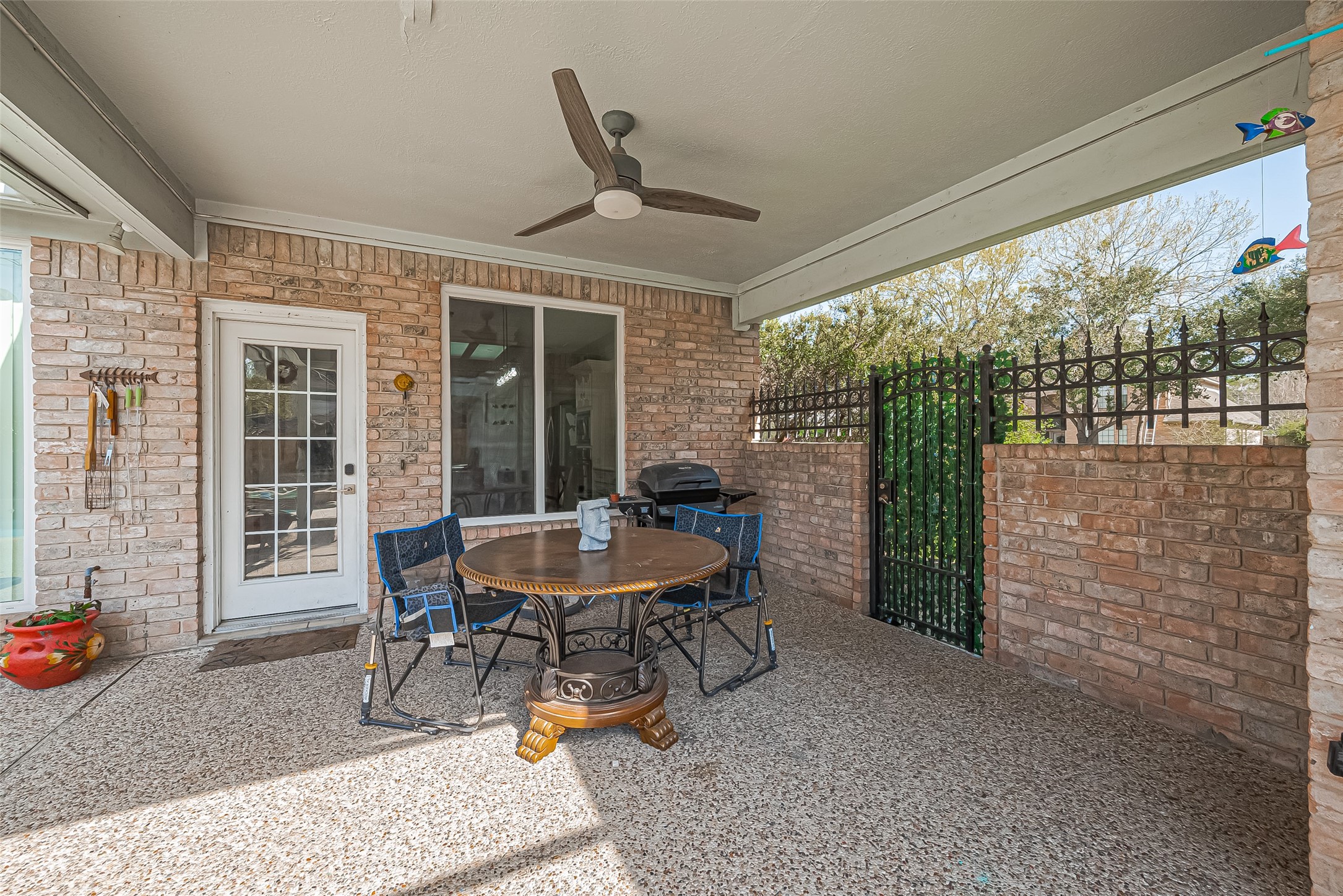 5803 Slashwood Lane Spring, TX 77379 - Photo 43 of 46 Spacious covered patio perfect for outdoor relaxation and entertaining.