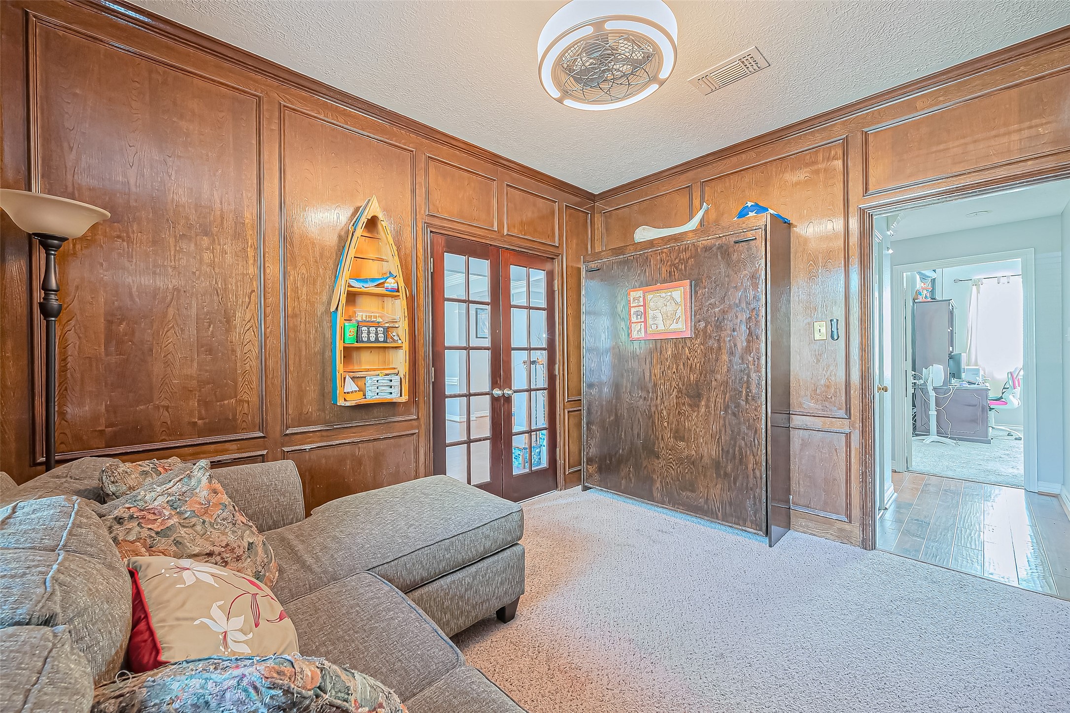5803 Slashwood Lane Spring, TX 77379 - Photo 9 of 46 Elegant office space with rich wood paneling and abundant natural light, perfect for productivity and creativity.