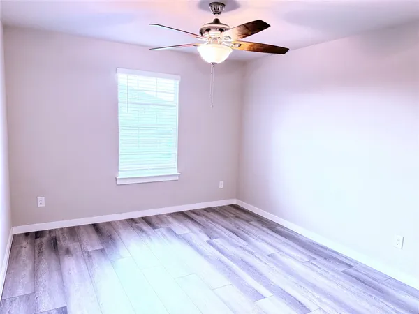 a bathroom with a sink toilet vanity and shower