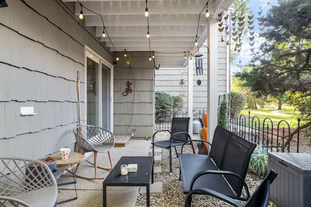 a outdoor space with patio the couches and a dining table with chairs