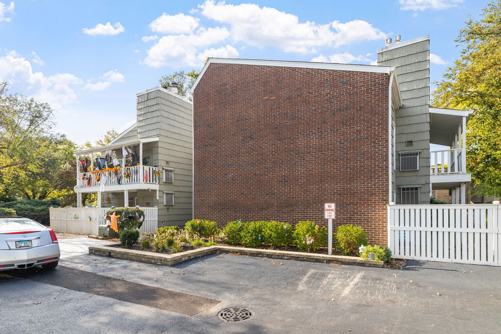 1420 Stonebridge Trail, Unit 13 Wheaton, IL 60189 - Photo 19 of 24 a view of a street with cars