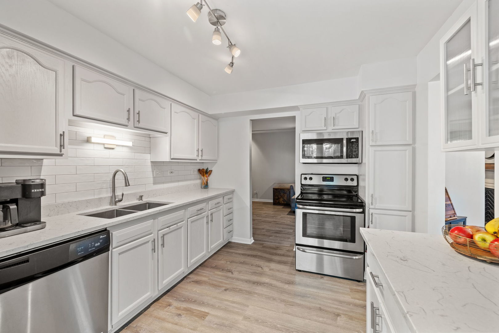 1420 Stonebridge Trail, Unit 13 Wheaton, IL 60189 - Photo 7 of 24 a kitchen with a sink stove and refrigerator