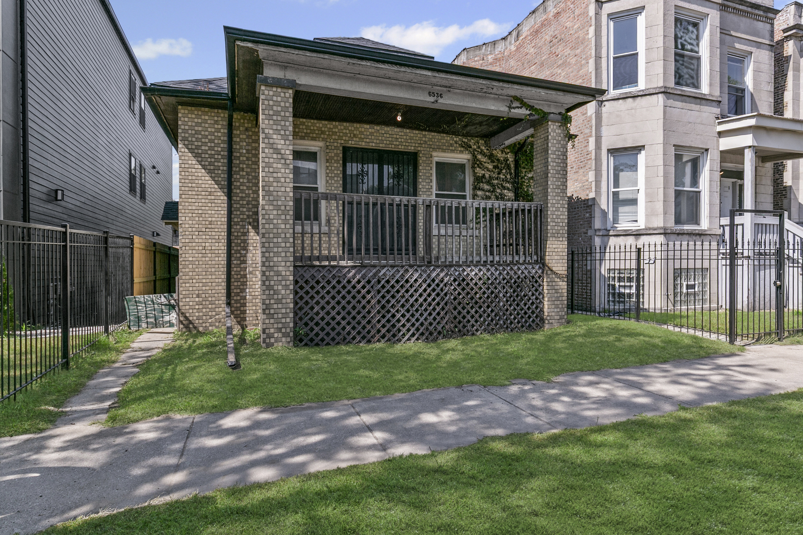 6536 South Rhodes Avenue Chicago, IL 60637 - Photo 2 of 21 a view of a house with a yard