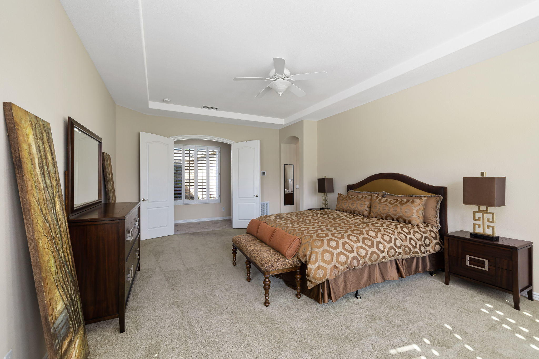 81189 Red Rock Road La Quinta, CA 92253 - Photo 21 of 85 a bedroom with a bed dresser and a large mirror
