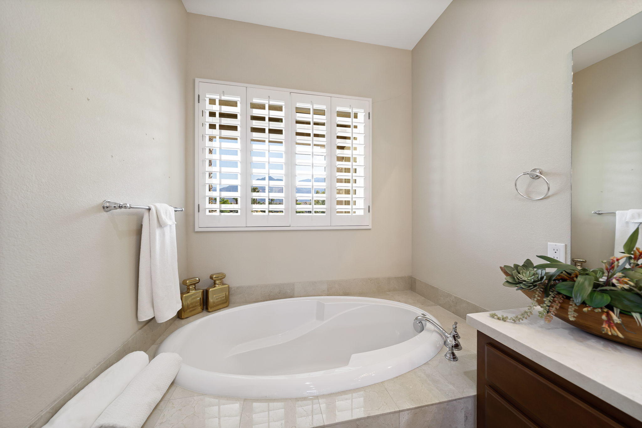 81189 Red Rock Road La Quinta, CA 92253 - Photo 25 of 85 a white bath tub sitting in a bathroom next to a window