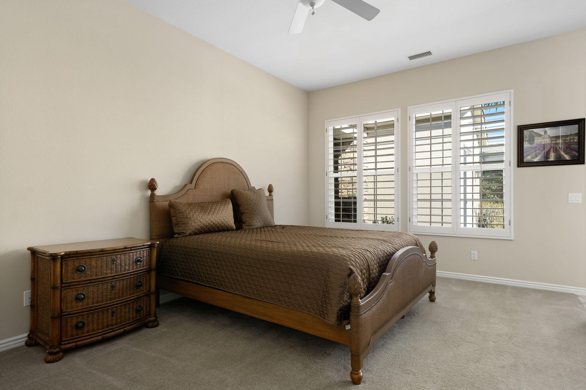 81189 Red Rock Road La Quinta, CA 92253 - Photo 27 of 85 a bed sitting in a bedroom next to a window