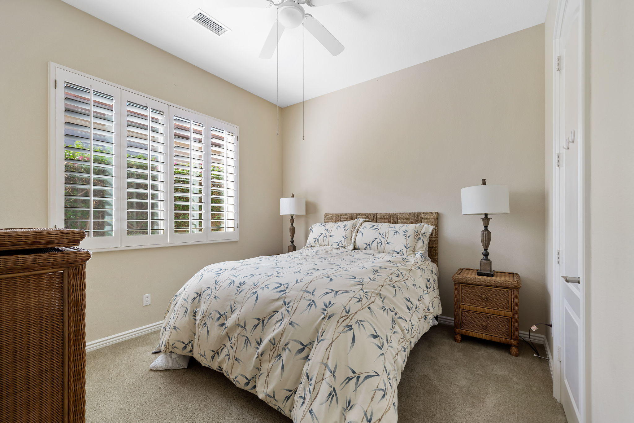 81189 Red Rock Road La Quinta, CA 92253 - Photo 28 of 85 a bedroom with a bed and a window